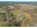 Aerial view of house and expansive lot with outbuildings at 601 Rasley Rd, New Smyrna Beach, FL 32168