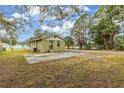 Backyard view of a house with a large paved area at 639 Florida Ave, Daytona Beach, FL 32117