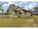 Side view of a light green brick house at 639 Florida Ave, Daytona Beach, FL 32117