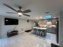 Open concept kitchen with a large island and gray cabinets at 744 Baywood Ln, South Daytona, FL 32119