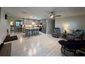 Modern kitchen with gray cabinets, an island, and stainless steel appliances at 744 Baywood Ln, South Daytona, FL 32119
