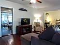 Cozy living room featuring hardwood floors and a comfortable seating area at 1122 Ne 9Th St, Ocala, FL 34470