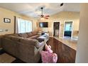 Spacious living room with L-shaped sofa and wood flooring at 1387 Hensley Dr, Deland, FL 32724