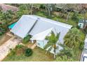 Single-story house, gray roof, green exterior, landscaping, and driveway at 1412 Oak Forest Dr, Ormond Beach, FL 32174