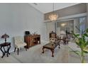 Living room features hardwood floors, a large window, and a built-in cabinet at 1450 Alden St, Deland, FL 32720