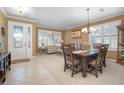 Bright entryway with a view of the dining room and living room areas at 204 Wellington Woods Ave, Deland, FL 32724
