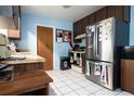 Kitchen has stainless steel appliances and light blue walls at 262 Valencia Rd, Debary, FL 32713