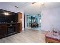 Open living space with wood-look floors, showing access to dining area at 262 Valencia Rd, Debary, FL 32713