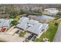 Townhouse community with pond and lush landscaping at 347 Castlewood Ln, New Smyrna Beach, FL 32168