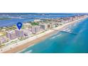 Condominium building's location showcased with aerial view of beach at 3737 S Atlantic Ave # 504, Daytona Beach, FL 32118