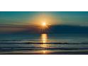 Sunrise over the ocean, showcasing the property's stunning beach location at 3737 S Atlantic Ave # 504, Daytona Beach, FL 32118