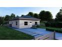 Front view of a single story house with gray siding, and a walkway at 542 N Charles St, Daytona Beach, FL 32114