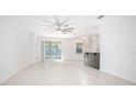 Bright and spacious living room with tile floors and ceiling fan at 555 Morgan Wood Dr, Deland, FL 32724