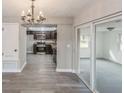 Modern kitchen with dark cabinetry and stainless steel appliances at 916 Tracy St, Daytona Beach, FL 32117
