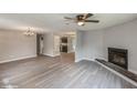 Open living room with a view into the kitchen and fireplace at 916 Tracy St, Daytona Beach, FL 32117