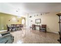 Spacious dining area with tile floors and a view of the living room at 101 Los Arbor Dr, Deland, FL 32724