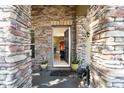Inviting front entrance with stone columns and a view into the home at 101 Los Arbor Dr, Deland, FL 32724