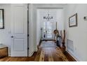 Bright and airy entryway with hardwood floors and a view to the back at 1137 Avery Meadows Way, Deland, FL 32724