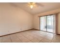 Bright bedroom with tile flooring and sliding glass doors to patio at 1260 Charter Oaks Cir, Daytona Beach, FL 32117