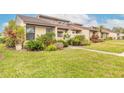 Side view of villa showcasing neat landscaping and exterior at 1260 Charter Oaks Cir, Daytona Beach, FL 32117