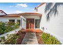 Inviting entryway with double doors and terracotta tile floor at 129 Oyster Catcher Ct, Daytona Beach, FL 32119