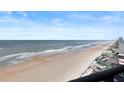 Stunning ocean view from condo balcony, showing beach and coastline at 1420 N Atlantic Ave # 1102, Daytona Beach, FL 32118