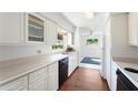 Efficient kitchen with white cabinets, and modern appliances at 1612 Beatrice Dr, Orlando, FL 32810