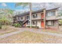 Two-story building with multiple units and walkways at 1668 Spring Garden Ct # 1668, Daytona Beach, FL 32117