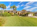 Attractive home with a manicured lawn and a welcoming front entrance framed by lush greenery at 1930 Seclusion Dr, Port Orange, FL 32128