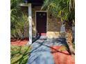Brick home with a burgundy front door and walkway at 213 Lone Pine Dr, Edgewater, FL 32132