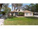 Lovely brick single Gathering home with a well kept lawn and beautiful tree shading at 2424 India Blvd, Deltona, FL 32738