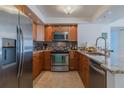 Modern kitchen with granite countertops and stainless steel appliances at 2967 S Atlantic Ave # 1706, Daytona Beach, FL 32118