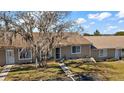 Street view of the house showcasing its curb appeal and landscaping at 30215 Tavares Ridge Blvd # 11, Tavares, FL 32778