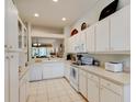 Efficient kitchen with white cabinets, ample counter space, and appliances at 3162 Kailani Ct, Ormond Beach, FL 32174
