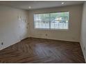 Bright living room with herringbone floors at 432 Sauls St, Ormond Beach, FL 32174