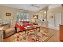 Bright living room with a comfortable seating area and hardwood floors at 675 Winterberry Trl, Deland, FL 32724