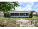 Large backyard with a screened patio and space for outdoor activities at 1016 Martex Dr, Apopka, FL 32703