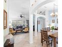 Open living and dining area with tiled floors and neutral decor at 1081 Treadway Dr, Deltona, FL 32738
