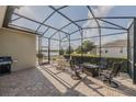 Relaxing screened patio with lake views and outdoor furniture at 1310 Eggleston Dr, Deland, FL 32724