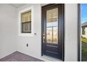 Close up of the front door and front porch of the residence at 1372 Lombardi Ct, Poinciana, FL 34759