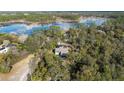 Gorgeous aerial view of home featuring a lake view with lush landscaping and serene surroundings at 149 Sheryl Dr, Deltona, FL 32738