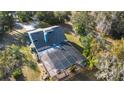Aerial view of screened-in pool, screened enclosure and view of the roof at 149 Sheryl Dr, Deltona, FL 32738