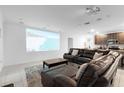 Dedicated home theater with projector and comfortable seating at 164 E Fiesta Key Loop, Deland, FL 32720