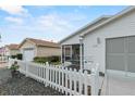 Front view of single story home with white picket fence at 2610 Hialeah Ave, The Villages, FL 32162