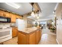 Open kitchen with island, flows to the living area, and offers scenic water views at 2711 N Halifax Ave # 463, Daytona Beach, FL 32118