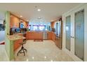 Bright kitchen featuring granite countertops and stainless steel appliances at 4 Oceans West Blvd # 502D, Daytona Beach Shores, FL 32118