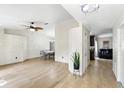 Spacious living room with light tile flooring, a decorative ceiling fan, and an open layout for flexible furnishing at 583 Wilburton Dr, Deltona, FL 32738