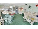 Bright, cheerful living room open to the kitchen, furnished with stylish seating and decor at 600 N Boundary Ave # 114B, Deland, FL 32720