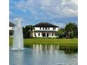 Beautiful backyard view of a lake and fountain at 6301 Swanson St, Windermere, FL 34786