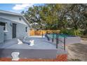 A spacious pool with a concrete deck and plenty of backyard area for entertaining guests at 829 Madison Ave, Daytona Beach, FL 32114